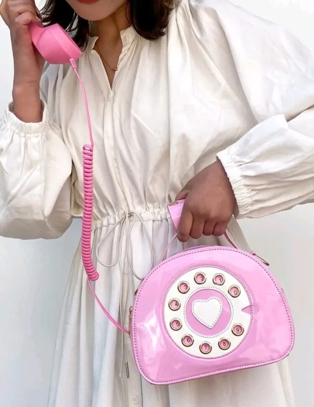 Bolso teléfono rosado