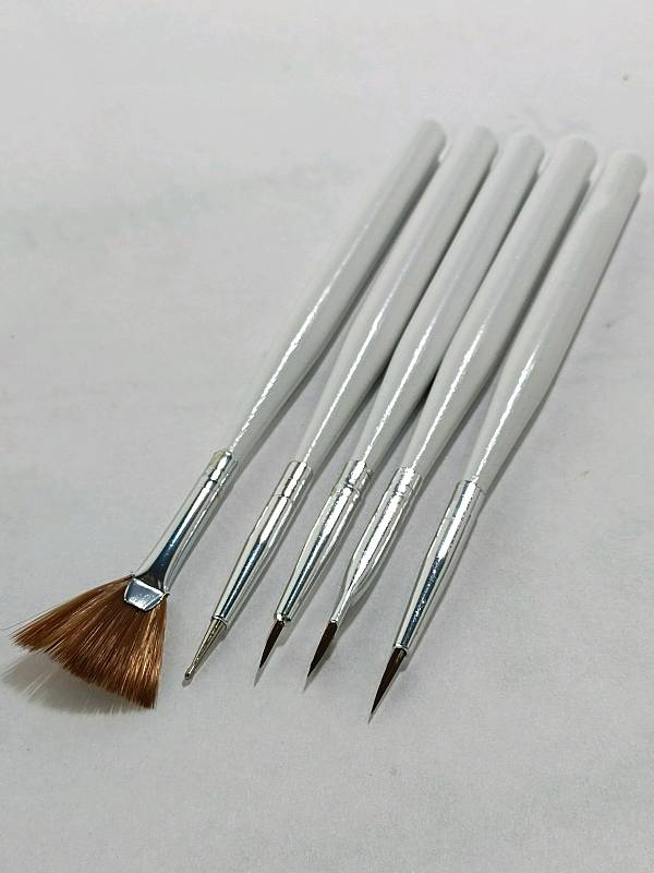 paintbrush, broom, nail