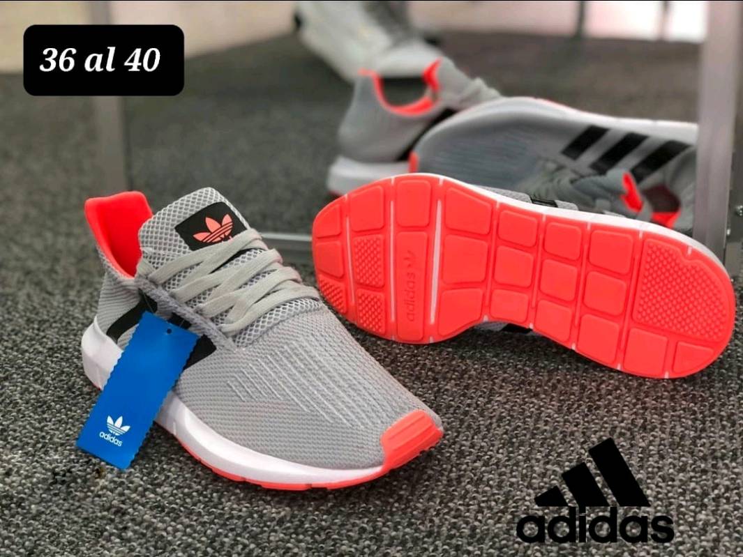 Tenis adidas gris con naranja store