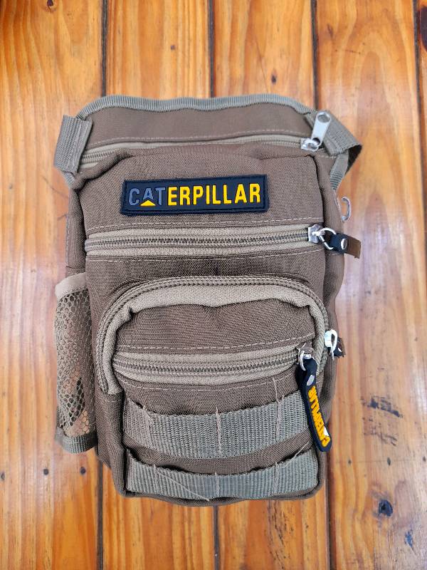 Morral caterpillar sale hombre