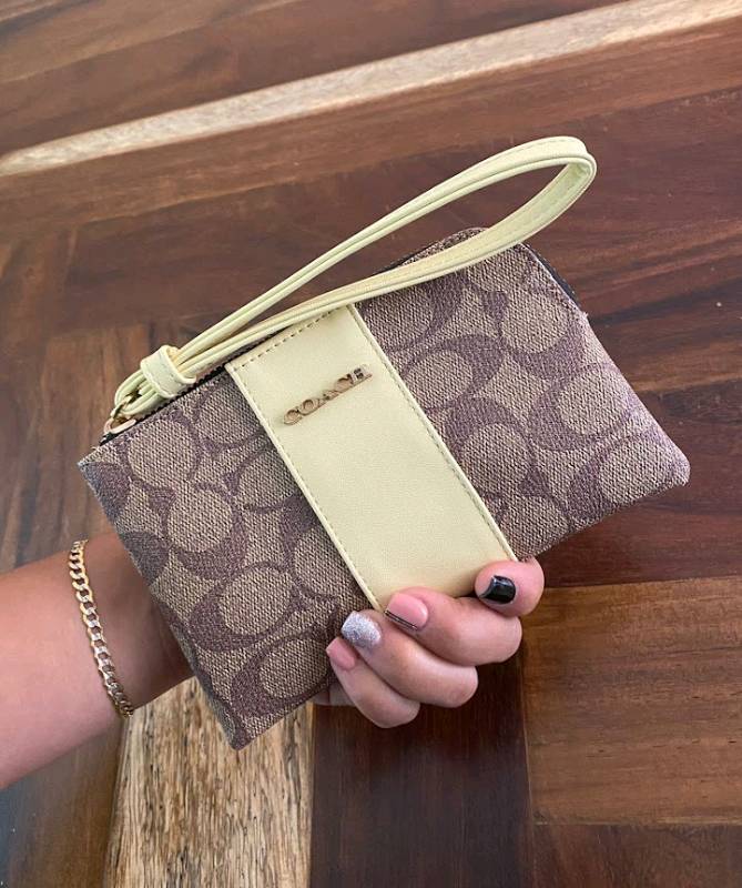 Precio de online muñequeras coach