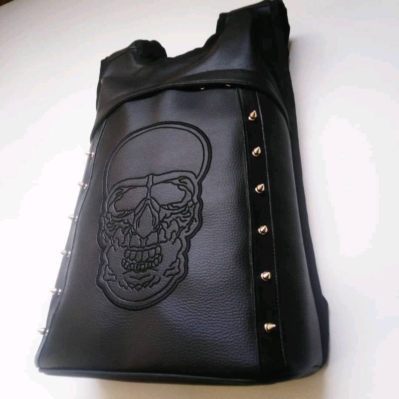 Mochila top con puas